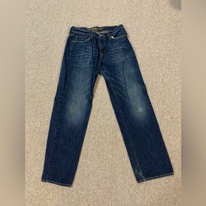American Eagle blue denim jeans, relaxed fit, waist 32”, inseam 34”.